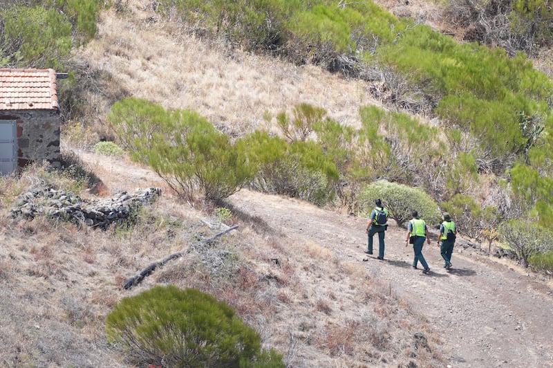Members of a search and rescue team near the last known location of Jay Slater