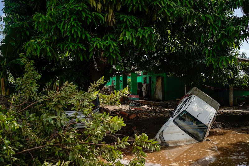 A vehicle lies damaged after Hurricane John passed through Coyuca de Benitez, Mexico (AP Photo/Felix Marquez)