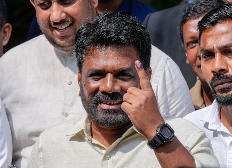 Sri Lankan President Anura Kumara Dissanayake as he leaves after casting his vote during the parliamentary election in (AP/Eranga Jayawardena)