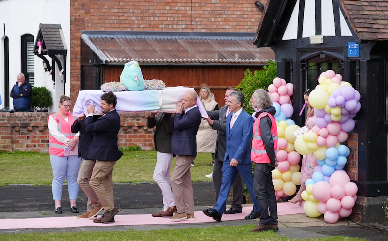 The coffin is carried out of St John’s Church in Birkdale