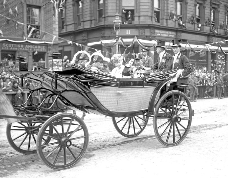 King George V and Queen Mary pass through the streets of Belfast during a visit to open the new Northern Ireland parliament in 1921 