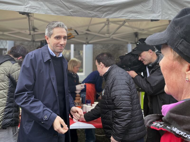 Taoiseach and Fine Gael leader Simon Harris takes part in a canvass around a Christmas market