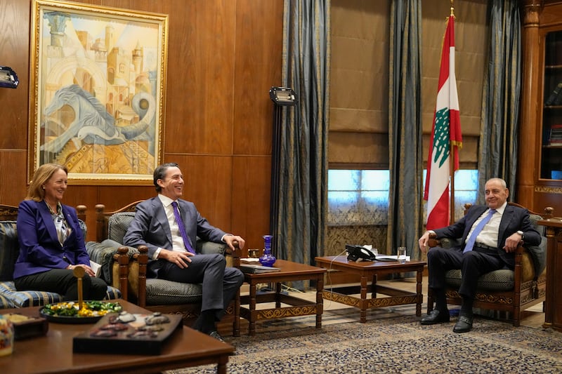 Amos Hochstein, centre, met Lebanese parliament speaker Nabih Berri, right (Hassan Ammar/AP)