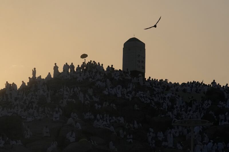 Muslim pilgrims pray at top of the Mountain of Mercy, on the Plain of Arafat, near the holy city of Mecca (Rafiq Maqbool/AP)