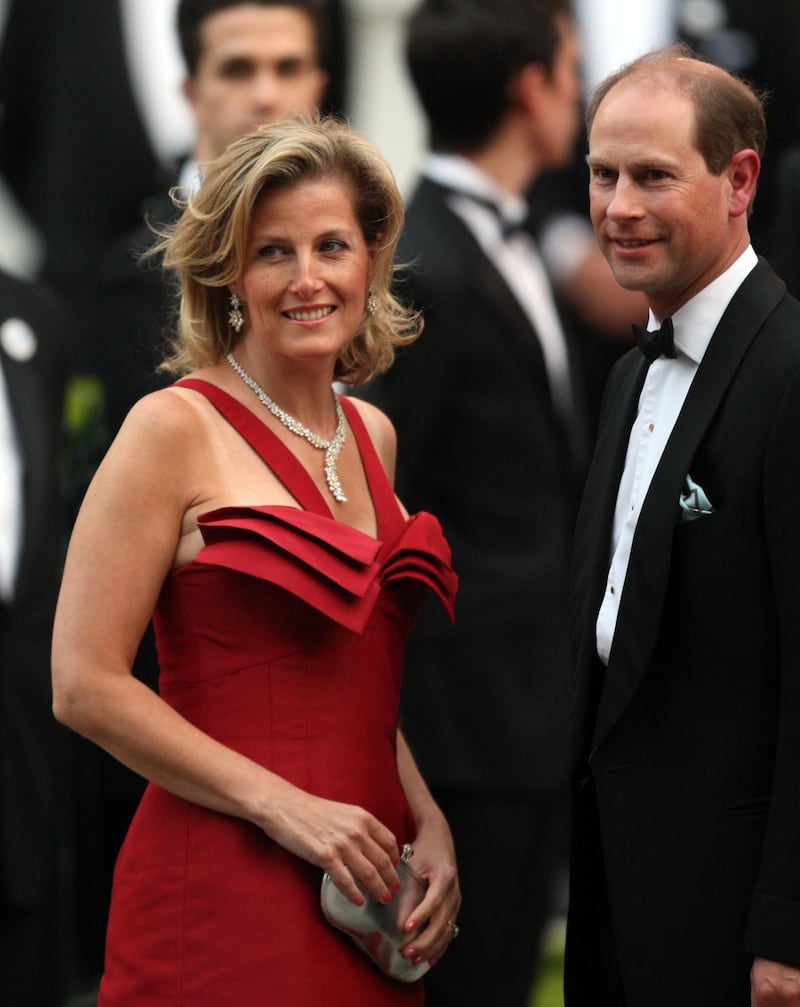 Sophie’s red dress was designed by British fashion designer, Bruce Oldfield