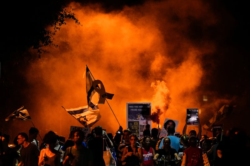 People in Tel Aviv attend a rally demanding a ceasefire deal and the immediate release of hostages held by Hamas in the Gaza Strip (Ariel Schalit/AP)