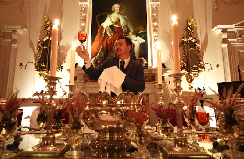 Final checks are made on the glassware as the stage is set for the dinner