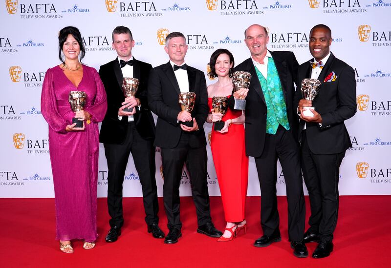 John Hay, Stephen Lambert, Toni Ireland and Stephen Yemoh in the press room after winning the Reality award for Squid Game: The Challenge at the BAFTA TV Awards 2024