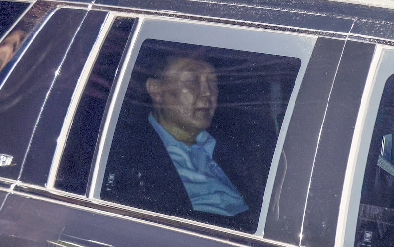 Impeached South Korean President Yoon Suk Yeol sits in a car as he heads to a detention centre in Uiwang, South Korea (Kim Sung-min/Yonhap via AP)