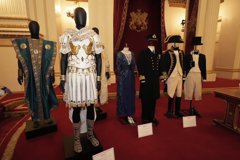 Costumes and items from films on display during a reception to mark the centenary of the Film and TV charity, at Buckingham Palace, London