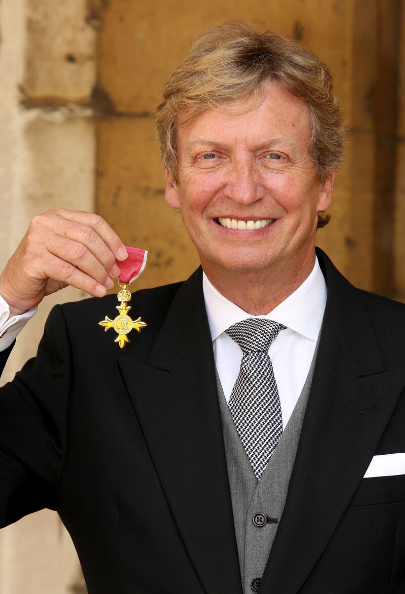 Nigel Lythgoe after receiving an OBE for services to the performing arts, education and charity during an Investiture ceremony at Windsor Castle