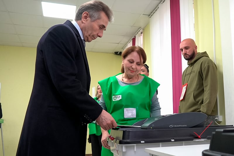 In this photo taken from video, Bidzina Ivanishvili, leader of the Georgian Dream party, votes at a polling station during the parliamentary election in Tbilisi, Georgia (Kostya Manenkov/AP)