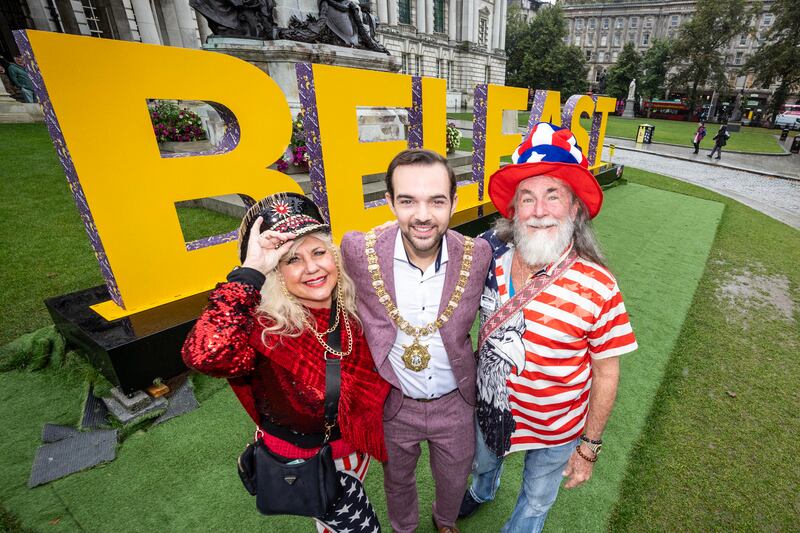 Melody and John Hennessee from Florida, dressed to celebrate Labor Day in the USA, pictured with the Lord Mayor of Belfast, Councillor Micky Murray.