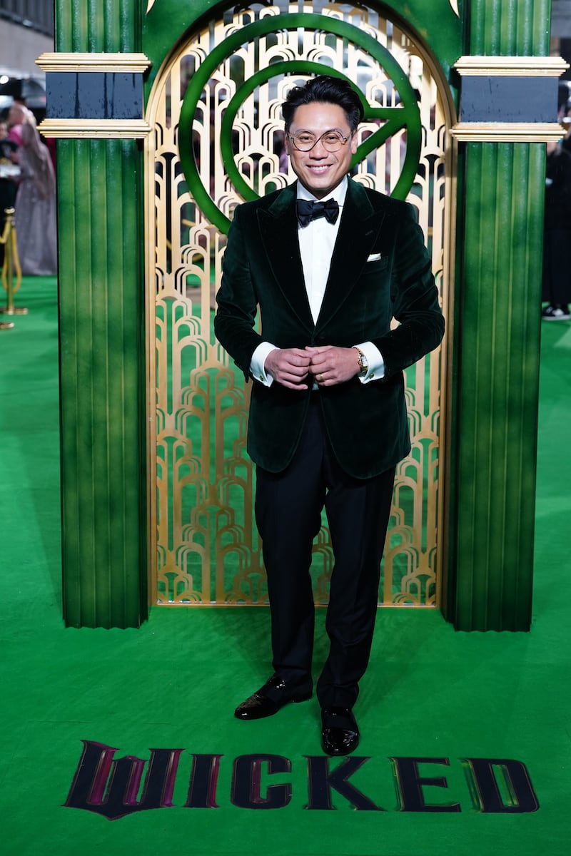 Director Jon M. Chu evoked Wicked’s Wizard in an emerald green suit