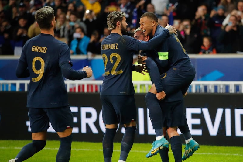 Kylian Mbappe, right, celebrates his goal 