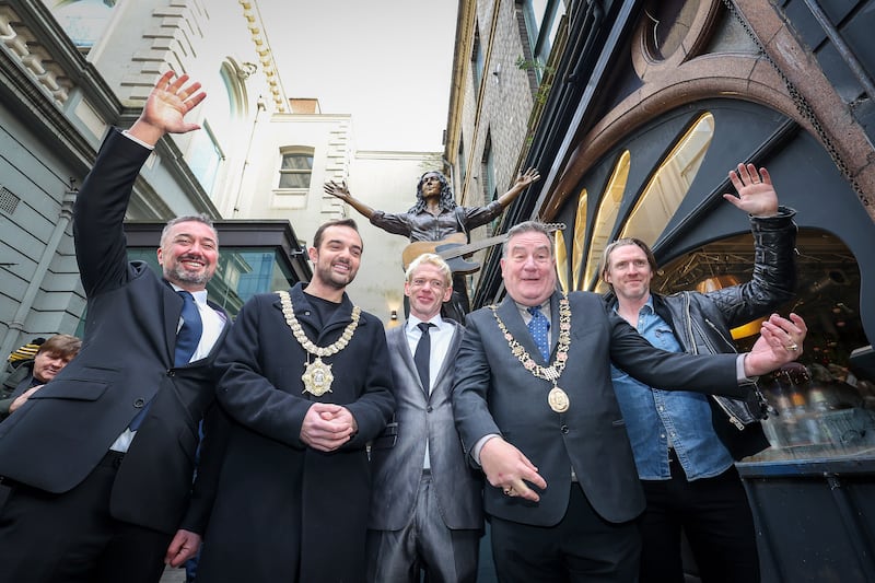 A commemorative statue of legendary composer and musician Rory Gallagher was revealed today at Ulster Hall, honouring his life, music, and his deep connection to Belfast. 
Crafted by renowned sculptors Anto Brennan, Jessica Checkley of Bronze Art Ireland, and David O’Brien of Bronze Art Ireland. It is inspired by a January 1972 Melody Maker magazine cover shot of Rory onstage at Ulster Hall. PICTURE: MAL MCCANN