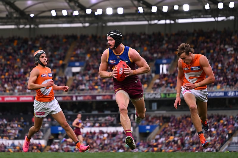 BRISBANE, AUSTRALIA - AUGUST 10: Darragh Joyce of the Lions runs with the bal during the round 22 AFL match between Brisbane Lions and Greater Western Sydney Giants at The Gabba, on August 10, 2024, in Brisbane, Australia. (Photo by Albert Perez/AFL Photos via Getty Images)