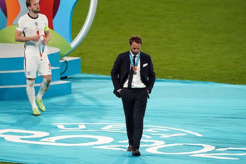 England manager Gareth Southgate and Harry Kane (left) were dejected following the Euro 2020 final loss to Italy