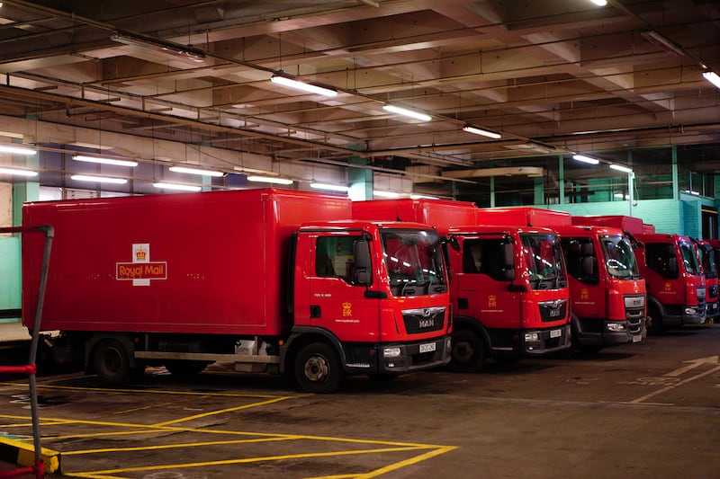 Royal Mail delivery vans parked up inside the Whitechapel delivery office