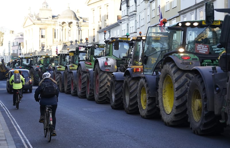 Tractors are lined up as farmers take part in a protest over the changes to inheritance tax (IHT) rules outside the Oxford Farming Conference