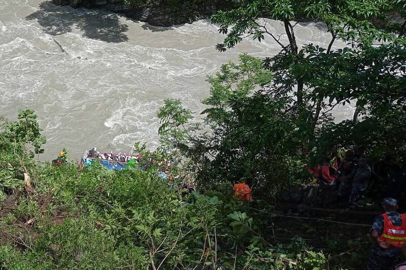 Rescuers above the river near Abukhaireni town (Nepal Armed Police Force/AP)