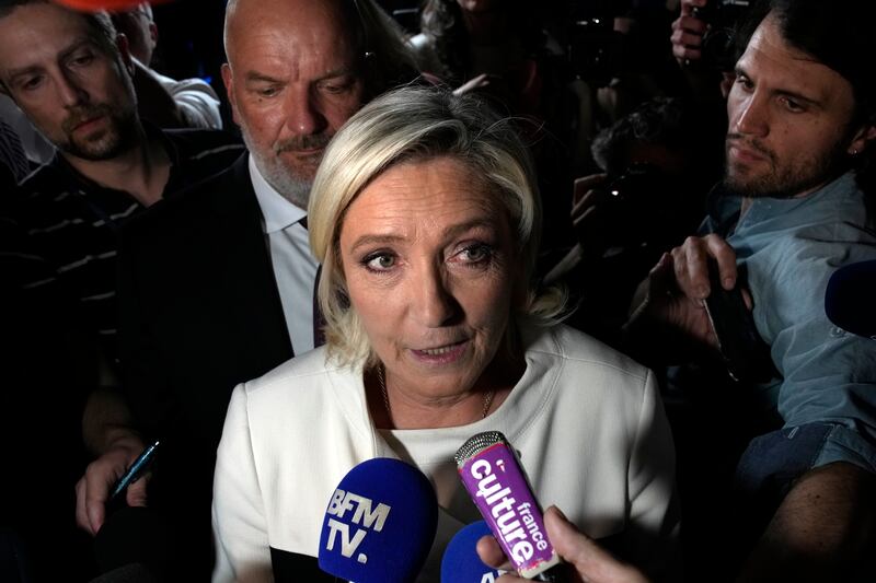 Far-right National Rally party leader Marine Le Pen answers reporters’ questions after the second round of the legislative election on Sunday (Louise Delmotte/AP)