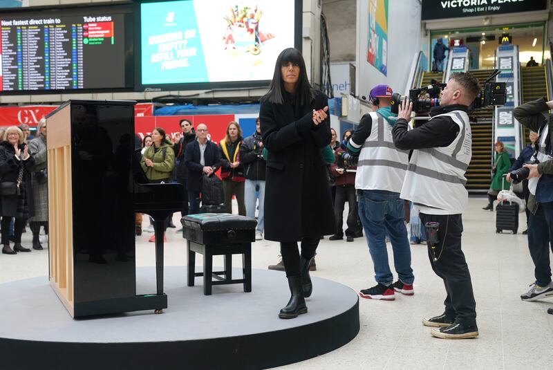 Claudia Winkleman at Victoria Train Station in London during filming for the television show The Piano