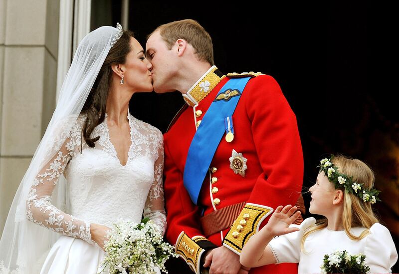 William and Kate kiss on the Palace balcony on their wedding day in 2011