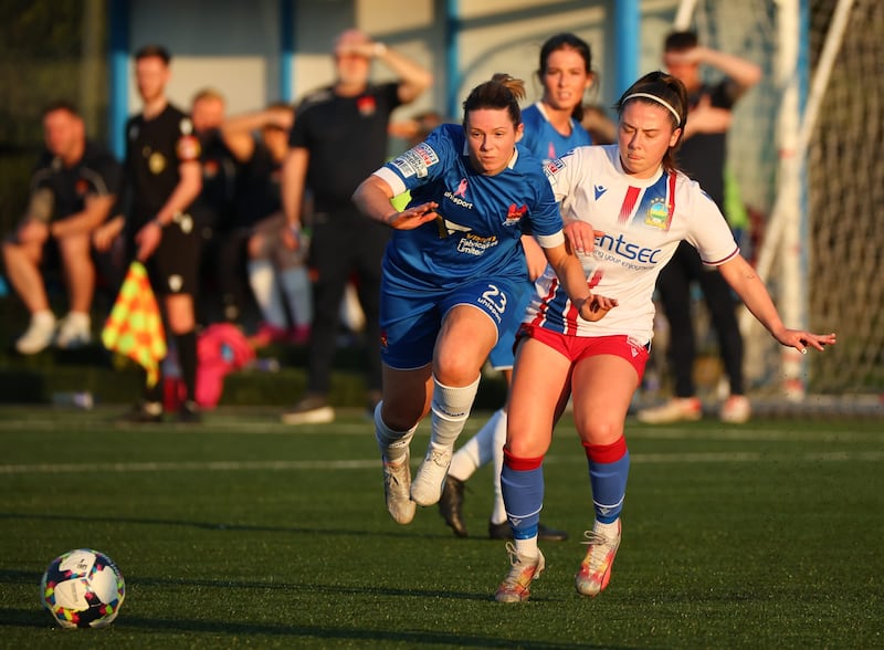 Rachel Kerr (Lisburn Ladies) and Mia Fitzsimmons (Linfield Women) battle for possession at the Bluebell Stadium (Photo: Paul Harvey)