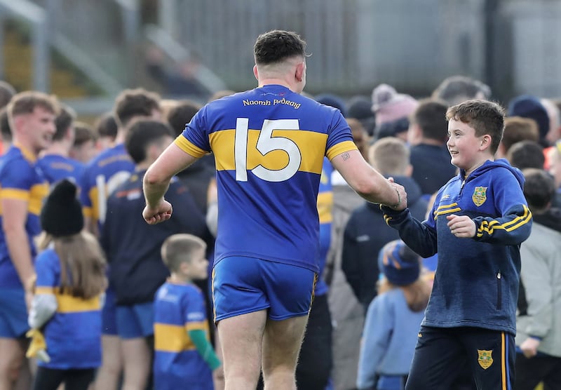 Naomh Padraig Caolan McColgan with the number 13 on his arm, greets a young supporter after Saturdays match. Naomh Padraig Donegal player Evan Craig 24 passed away after a battle with cancer in September 2024. He wore the number 13 jersey. His team beat Craigbane during the Ulster Junior Club Football Championship final played at Celtic Park Derry on Saturday 23rd November 2024. Picture Margaret McLaughlin