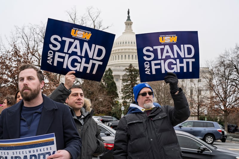 Activists join civil service workers to protest the policies of President Donald Trump and Elon Musk outside the Capitol in Washington on Tuesday (J Scott Applewhite/AP)