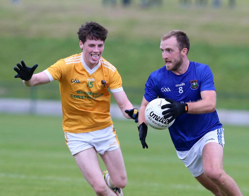 Clonduff's Patrick Cowan and Warrenpoint's Patrick Murdock in action during the Morgan Fuels Down SFC round one between Clonduff and Warrenpoint