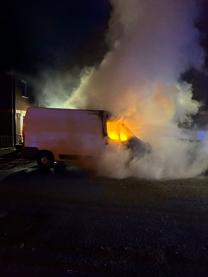 The work van on fire following an attack in south Belfast in August.