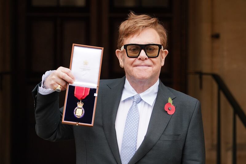 Sir Elton John after being made a member of the Order of the Companions of Honour for services to music and to charity