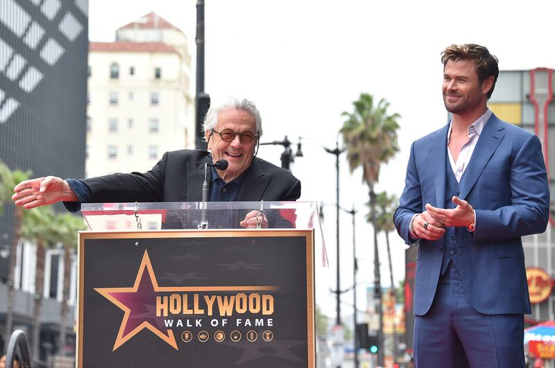 George Miller and Chris Hemsworth attend a ceremony honouring Hemsworth with a star on the Hollywood Walk of Fame (Jordan Strauss/Invision/AP)