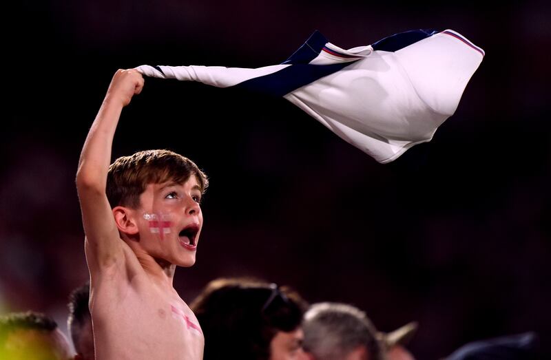 A young England fan tried to rally the team