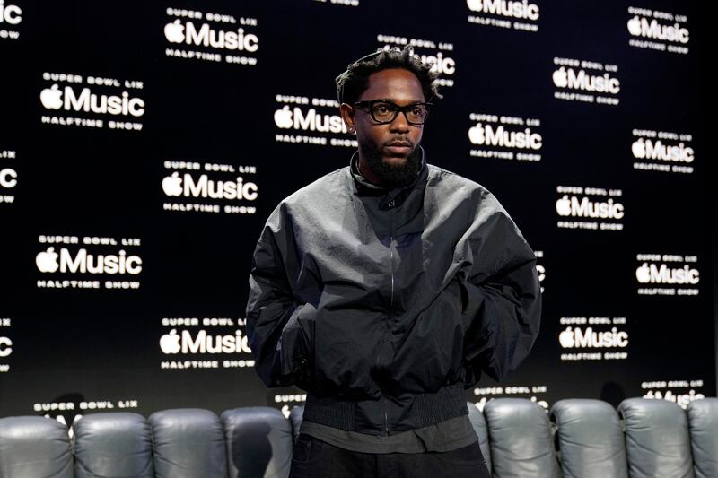 Kendrick Lamar poses for a photographers after a news conference in New Orleans ahead of the Super Bowl (Matt York/AP)