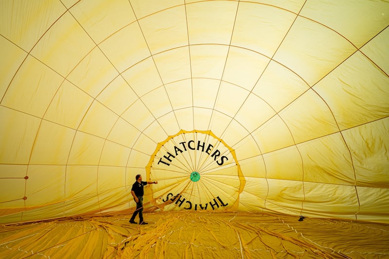 Hot air balloon pilots carry out checks before each flight