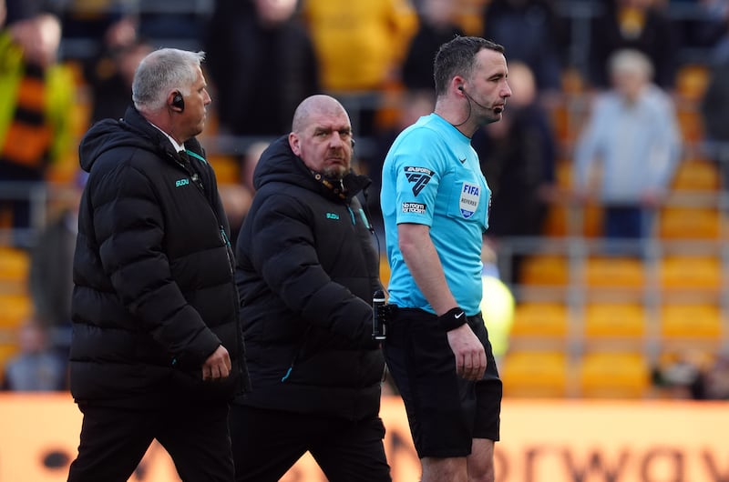 Referee Chris Kavanagh, right, awarded City the late goal