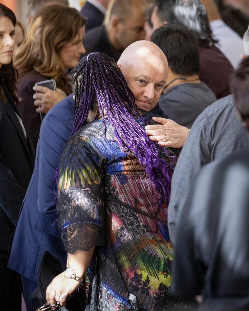 Prime Minister Christopher Luxon embraces a survivor following his apology over the widespread abuse of children and vulnerable adults in care (Monique Ford/Stuff/AP)