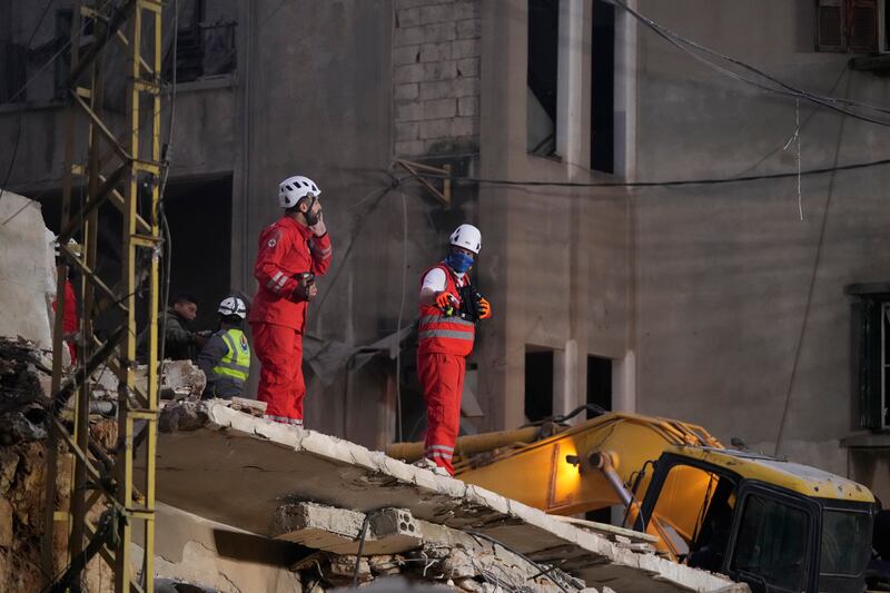 Rescuers search for victims at the site of an Israeli air strike in Beirut (Hassan Ammar/AP)