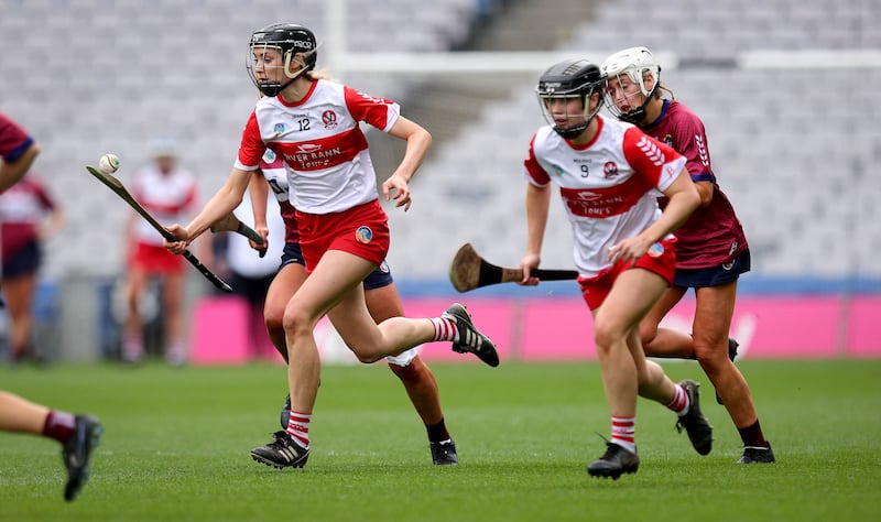 Bríd Rogers soloing the ball in Croke Park alongside Megan Kerr