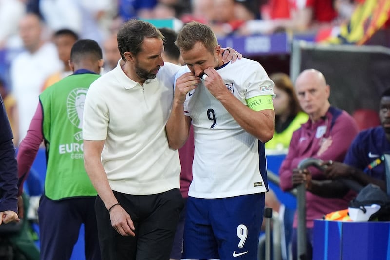 Gareth Southgate (left, with Harry Kane) has vowed to “keep grinding” amid the off-field noise