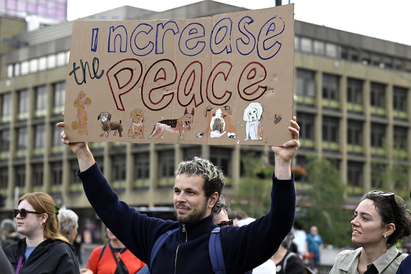 A protester calls for more peace after two weeks of disorder