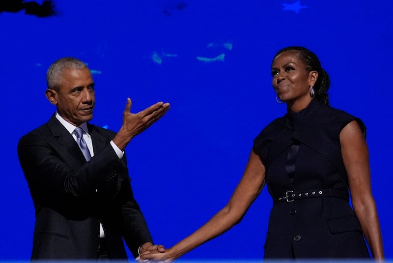 Former president Barack Obama and former first lady Michelle Obama as he is introduced during the Democratic National Convention (Brynn Anderson/AP)