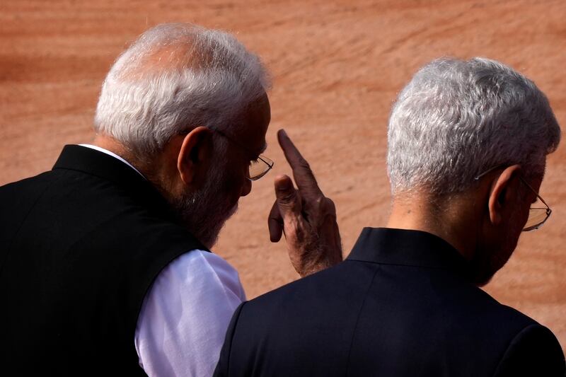 Indian Prime Minister Narendra Modi, left, talks with India’s foreign minister S Jaishankar as they arrive for the ceremonial reception of Greek Prime Minister Kyriakos Mitsotakis (Manish Swarup/AP)