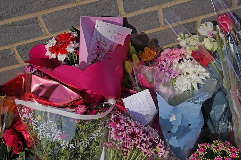 Floral tributes were left outside Leabank flats