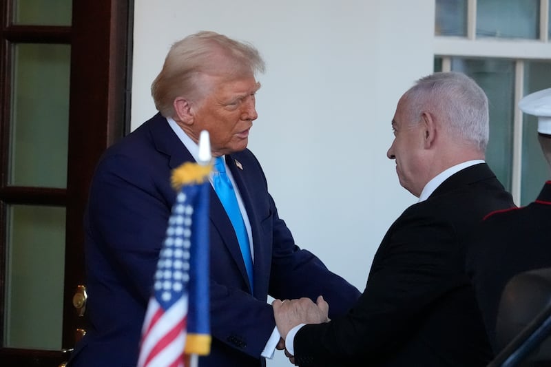 Donald Trump greets Benjamin Netanyahu as he arrives at the West Wing of the White House (Alex Brandon/AP)