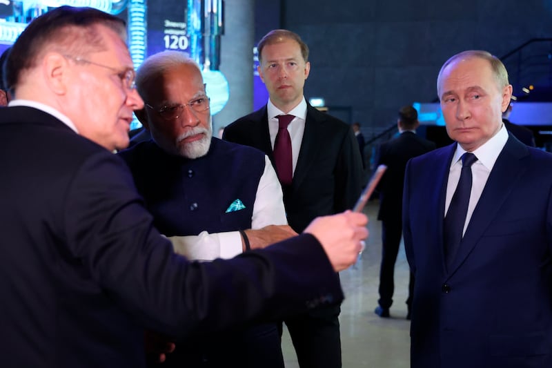 Russian State Atomic Energy Corporation Rosatom CEO Alexey Likhachev speaks to Narendra Modi and Vladimir Putin (Sergei Fadeichev, Sputnik, Kremlin Pool Photo via AP)