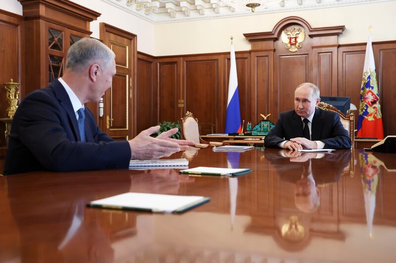 Russian President Vladimir Putin, right, listens to Vladimir Saldo, the Moscow-appointed governor of the Russian-controlled Kherson region of Ukraine, during their meeting at the Kremlin in June (Vyacheslav Prokofyev, Sputnik, Kremlin Pool Photo via AP)